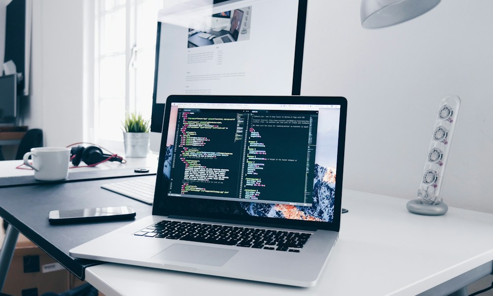 Laptop and digital tools used to connect design, engineering, and strategic implementation